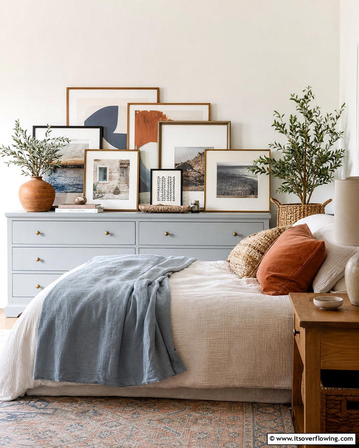 Layered Artwork - 25 Dresser Decor Ideas to Transform Your Bedroom