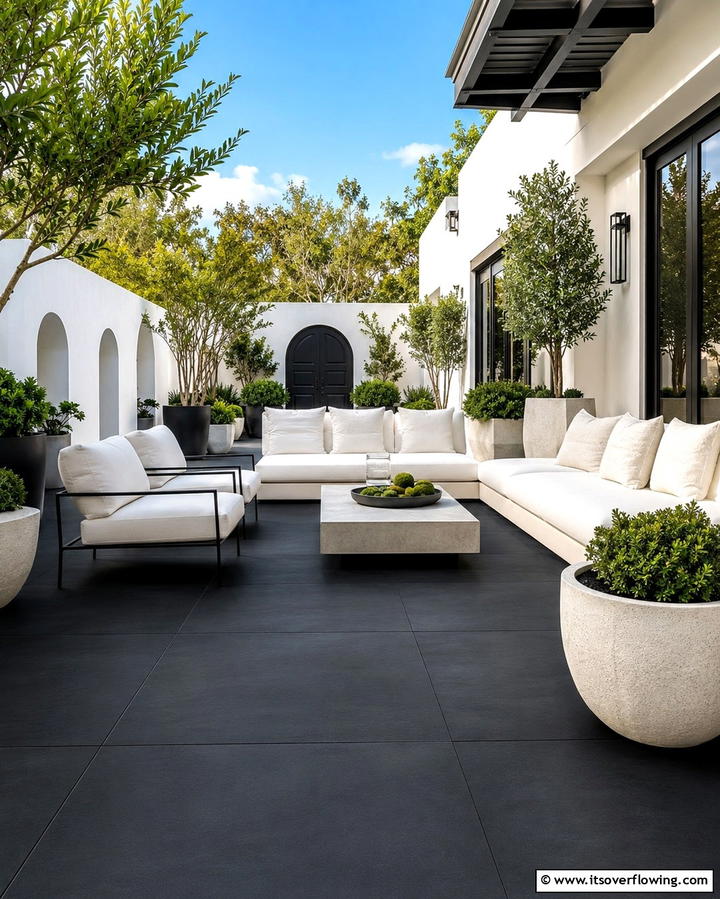 Light and Dark Contrast - 25 Black Concrete Patio Ideas for Modern Outdoor Spaces