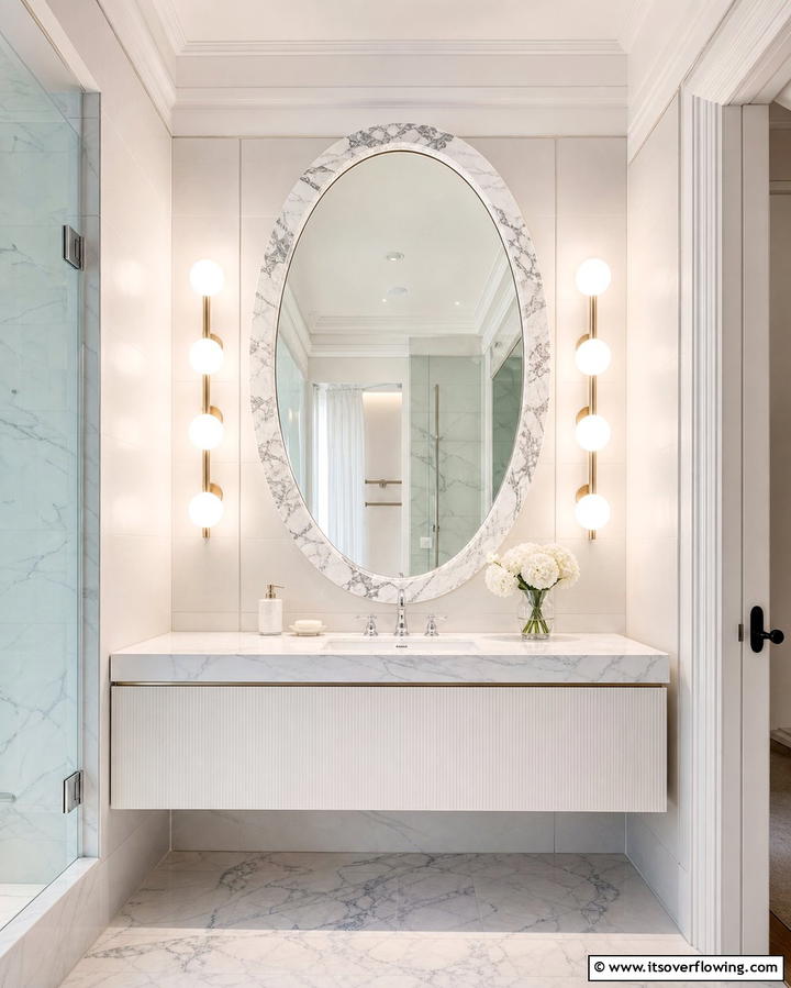 Marble Accent Mirror and Lighting - 30 Luxurious Marble Bathroom Ideas for a Spa-Like Retreat