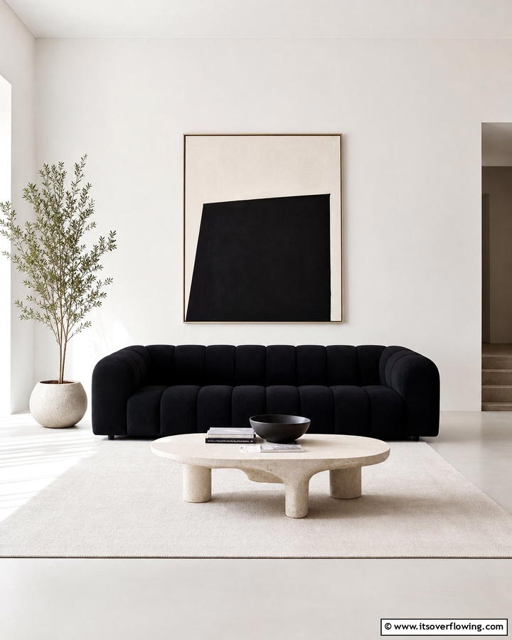 Minimalist Chic with a Black Couch Centerpiece - 21 Chic Black Couch Living Room Styling Inspirations