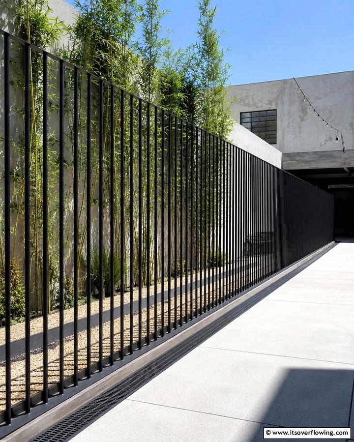 Minimalist Steel Fence - 30 Decorative Fence Ideas to Enhance Your Yard’s Aesthetic