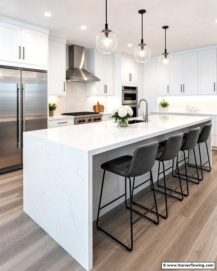 Opt for a Waterfall Edge Countertop - 25 White Kitchen with Stainless Steel Appliances Ideas