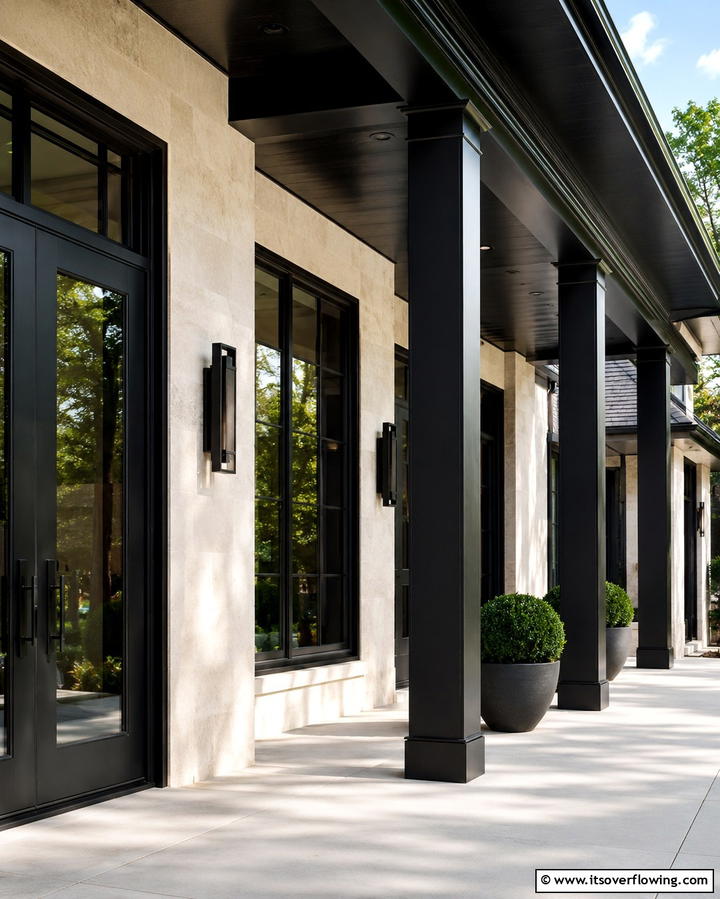 Polished Black Architectural Features - 30 Inviting Black Porch Ideas for a Modern Outdoor Oasis