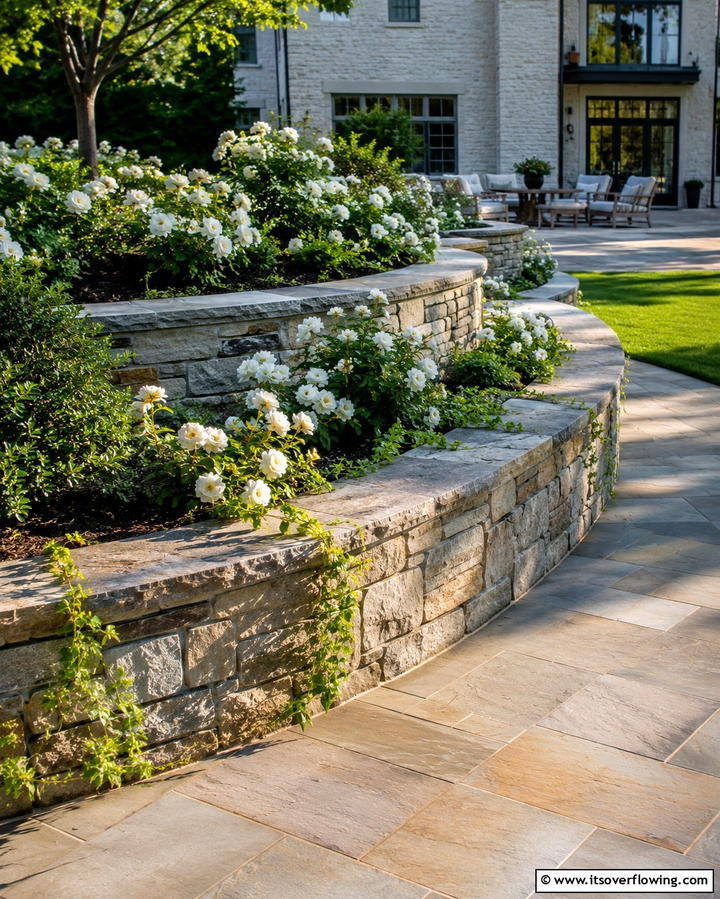 Raised Stone Borders for Elegance - 25 Low Maintenance Garden Border Ideas for Easy Landscaping