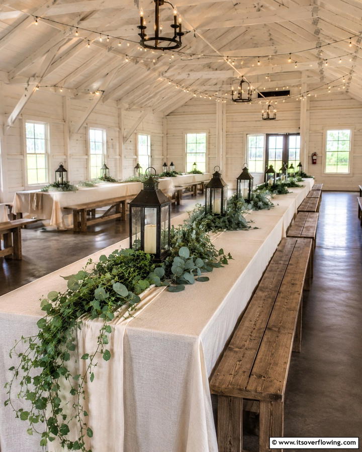Rustic Lanterns with Greenery - 30 Rehearsal Dinner Centerpiece Ideas for Memorable Nights