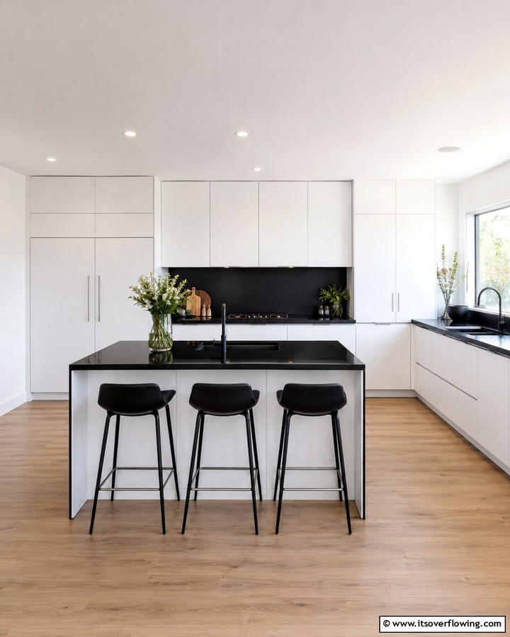 Seamless Integrated Appliances - 25 Kitchen With White Cabinets and Black Countertops Ideas
