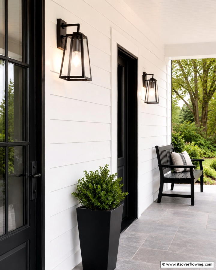 Sleek Black Porch Lighting - 30 Inviting Black Porch Ideas for a Modern Outdoor Oasis