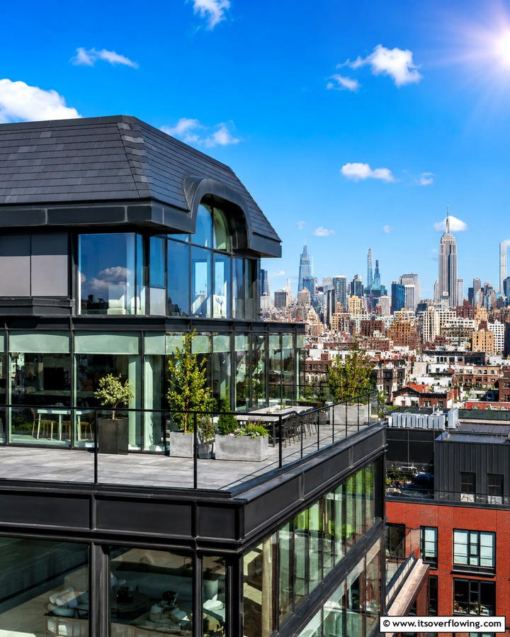 Sleek City Penthouse - 30 Houses with Black Roofs- Modern Exterior Design Inspiration