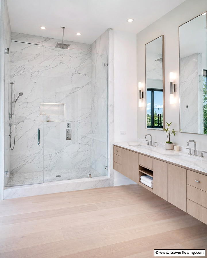Sleek Marble Shower Panels - 20 Stone Shower Design Ideas for a Spa-like Bathroom