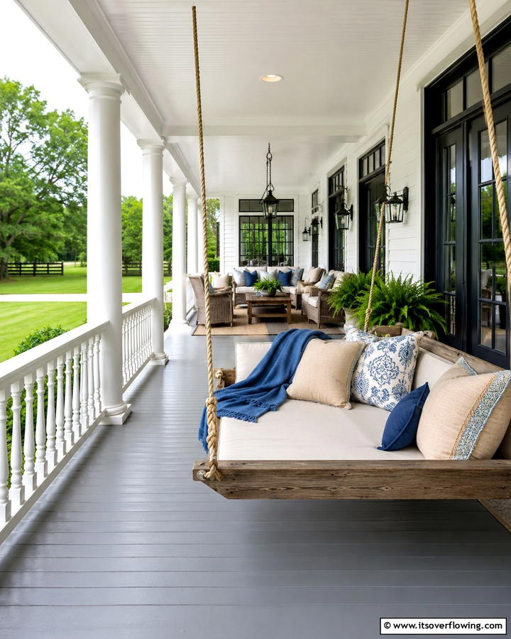 Spacious Wrap around Porch with Swing Seating - 20 White Farmhouse With Wrap-around Porch Ideas