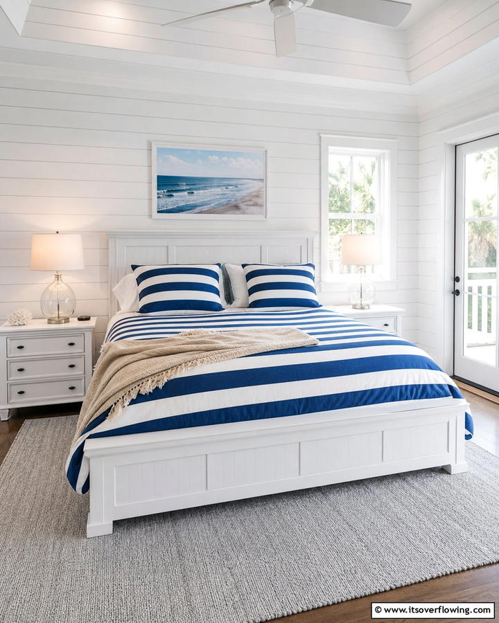 Striped Bedding for a Classic Touch - 25 Blue and White Bedroom Ideas for a Calming Space