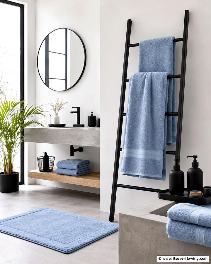 Subtle Blue Towels and Black Accessories Ensemble - 30 Striking Black and Blue Bathroom Ideas for Dramatic Flair
