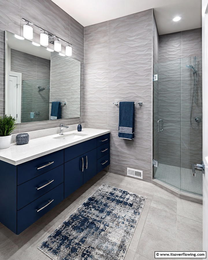 Textured Gray Tiles with Blue Accents - 25 Blue and Gray Bathroom Ideas for a Modern Look