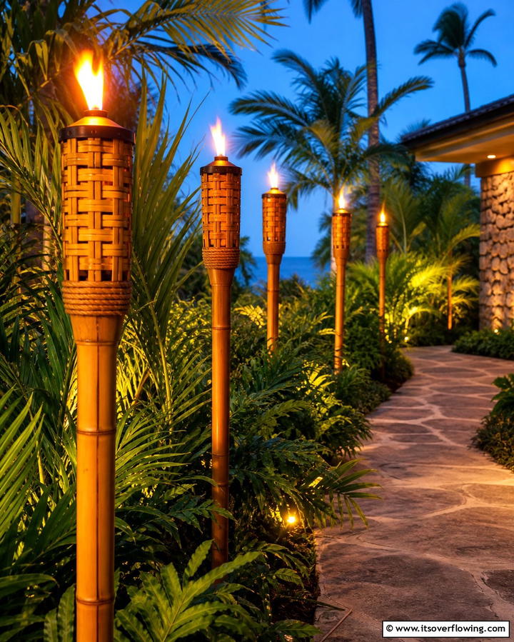 Tiki Torches for Ambiance - 25 Tropical Garden Ideas for a Lush Outdoor Oasis