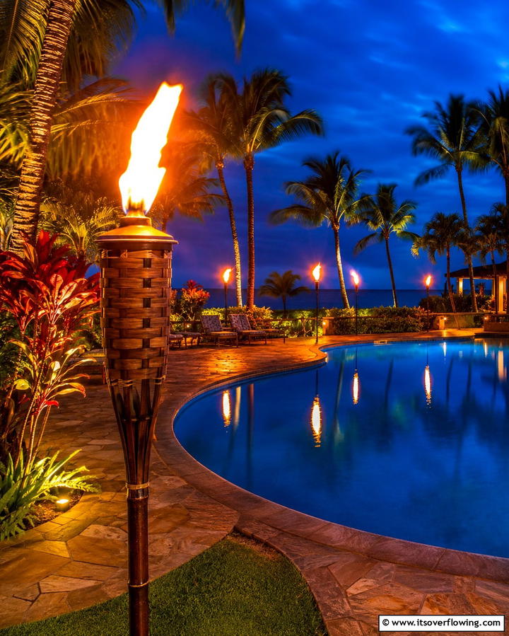 Tiki Torches for Evening Ambiance - 25 Tropical Pool Landscaping Ideas for a Resort Feel