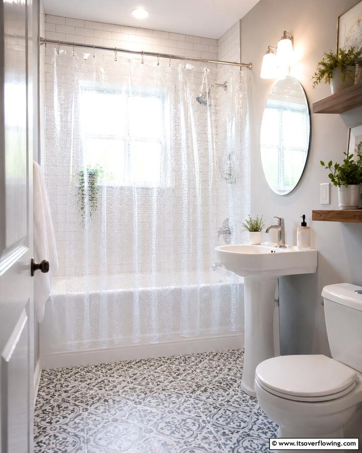 Use Transparent Shower Curtains - 25 Apartment Bathroom Ideas to Maximize Small Spaces