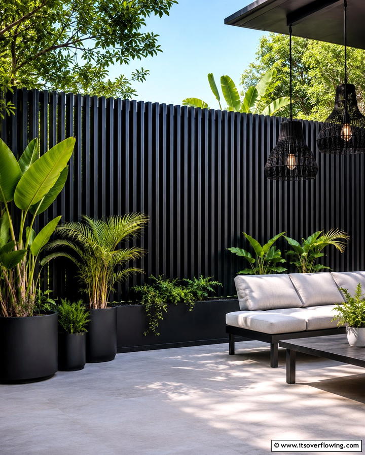 Vertical Slat Black Fence - 25 Black Fence Ideas for Modern Outdoor Spaces