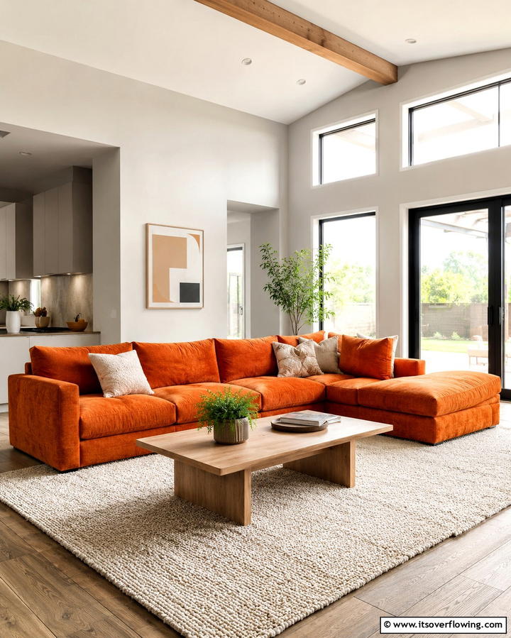Vibrant Contrast with Neutral Walls - 25 Orange Couch Living Room Ideas for a Vibrant Space