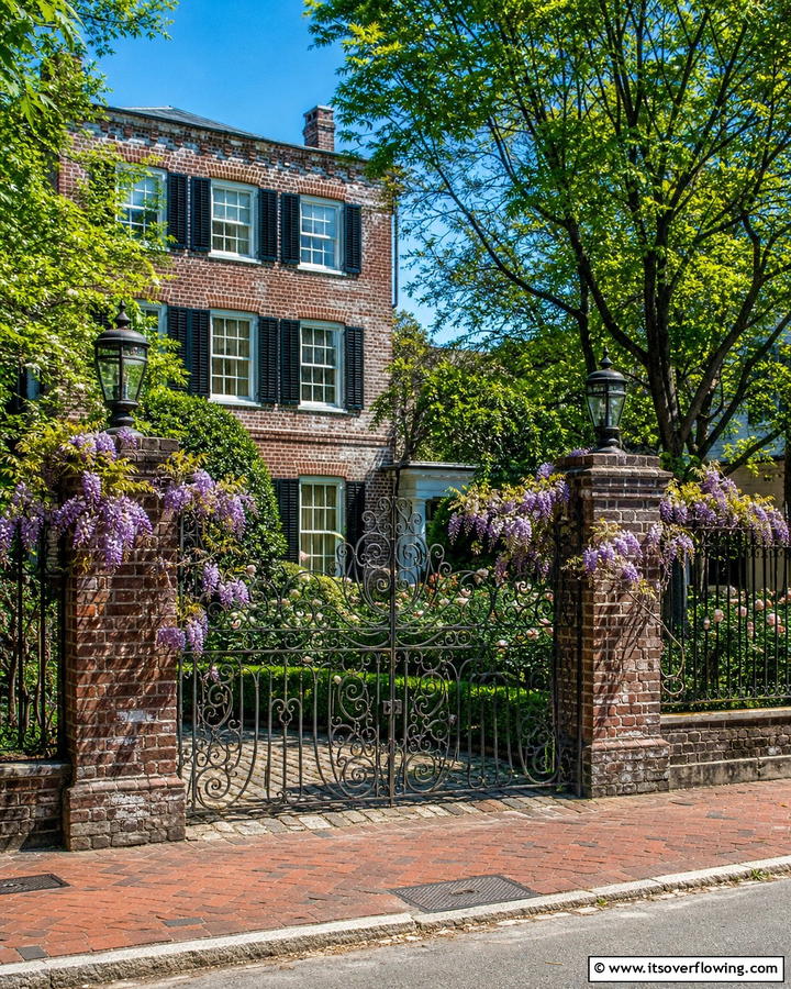 Vintage Brick Fence with Iron Gate - 20 Front Yard Brick Fence Ideas for a Classic Look