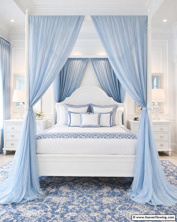 White Canopy Beds with Blue Drapes - 25 Blue and White Bedroom Ideas for a Calming Space