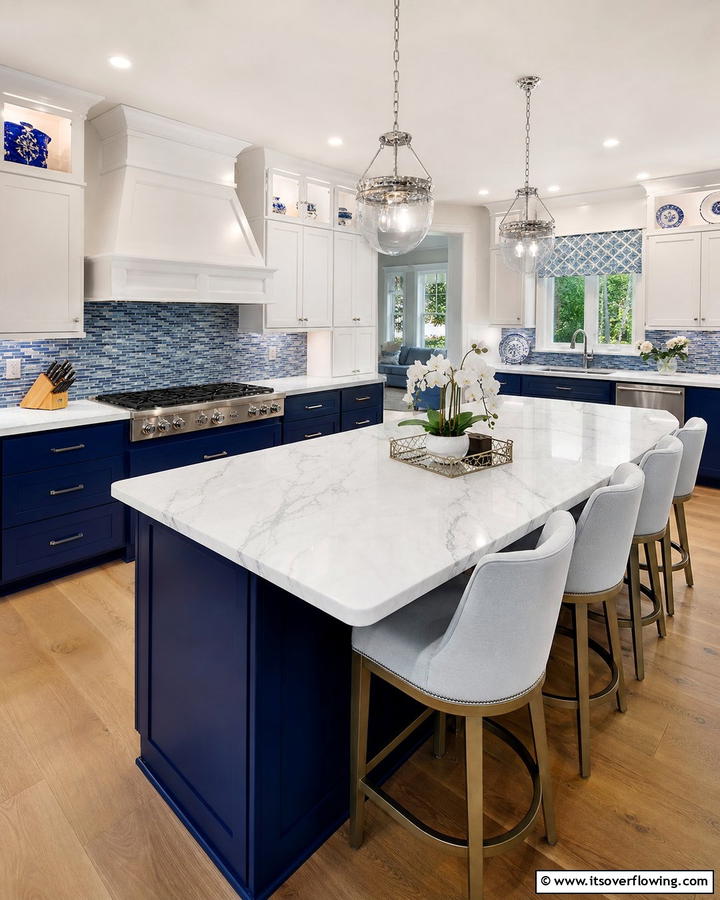 White Marble Countertops with Blue Accents - 25 Blue and White Kitchen Ideas for a Fresh and Timeless Look
