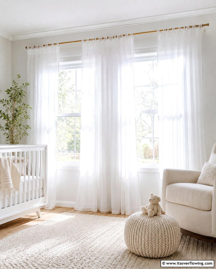 White Sheer Curtains for Soft Lighting - 25 White Nursery Ideas for a Calming Baby Room