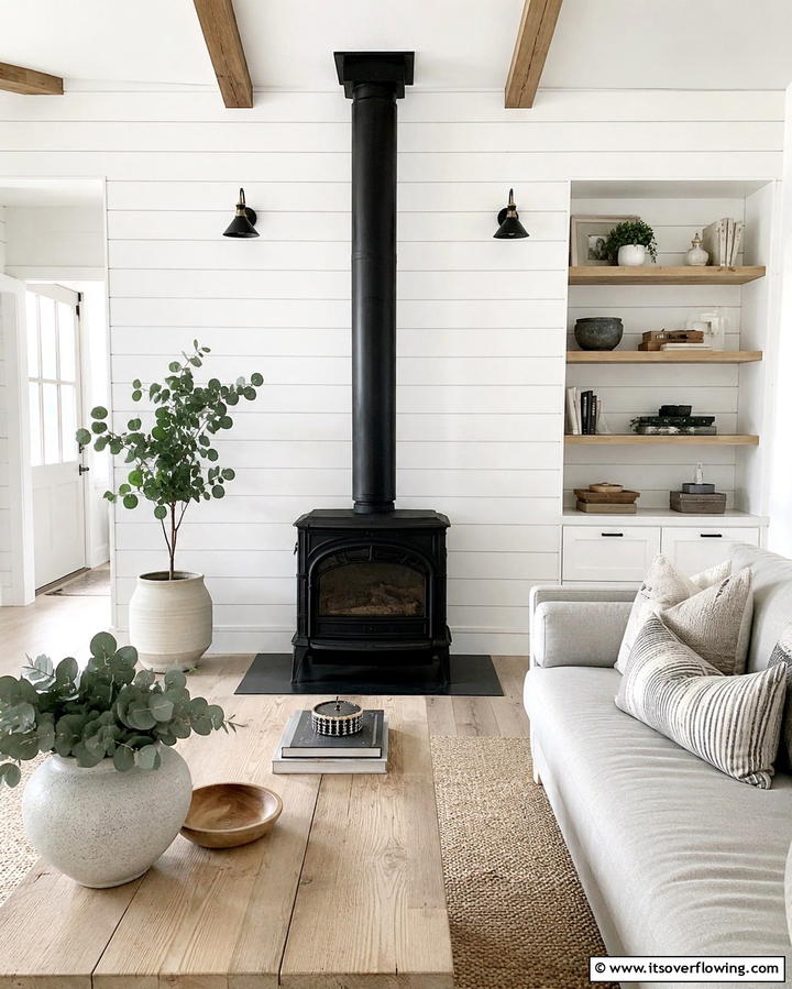 White Shiplap with Contrasting Stove - 30 Cozy Wood Stove Surround Design Inspirations