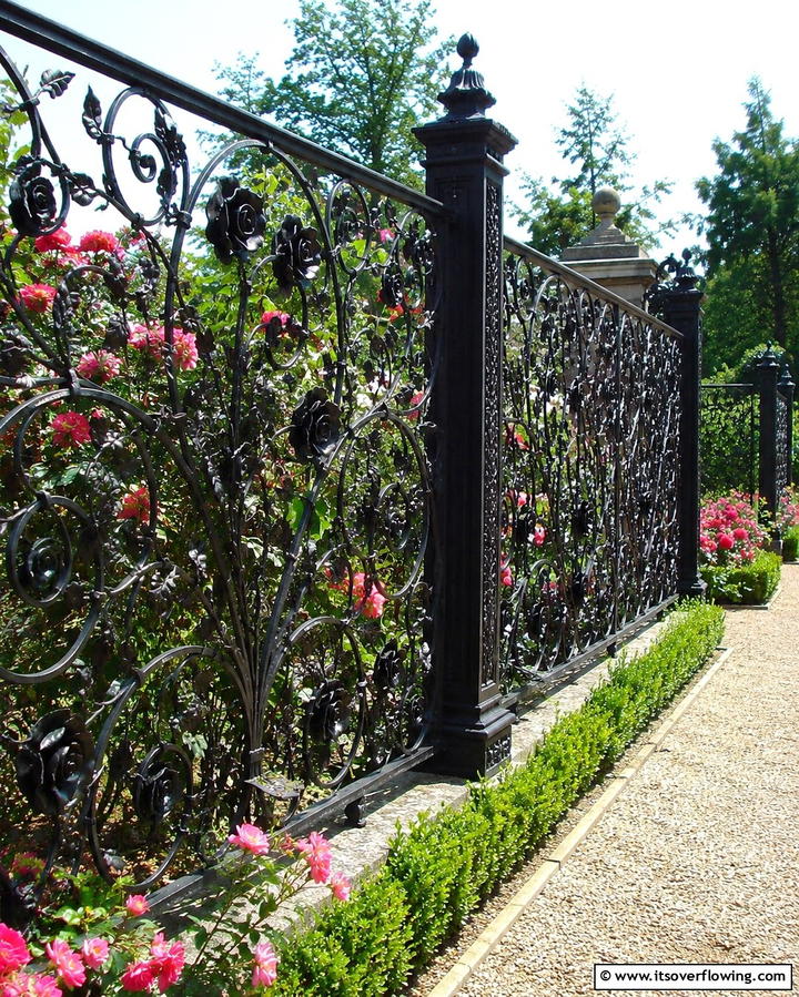 Wrought Iron with Floral Designs - 30 Decorative Fence Ideas to Enhance Your Yard’s Aesthetic