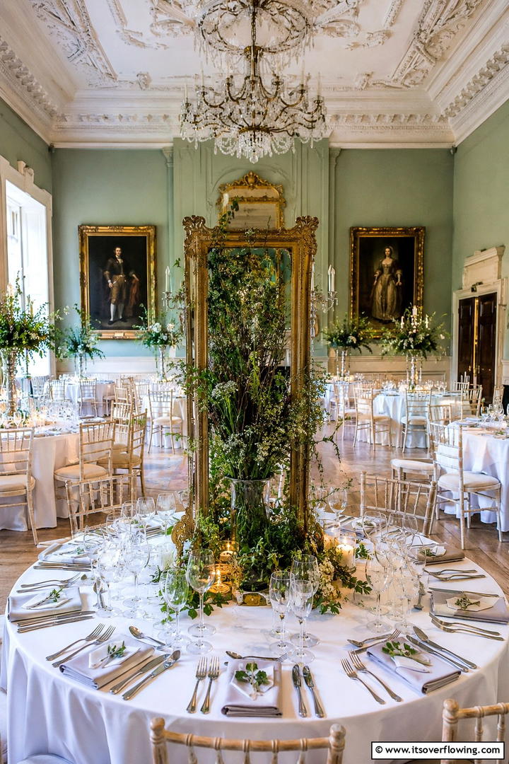 Antique Frame with Wild Greenery - 30 Rustic Wedding Centerpieces for a Charming Celebration