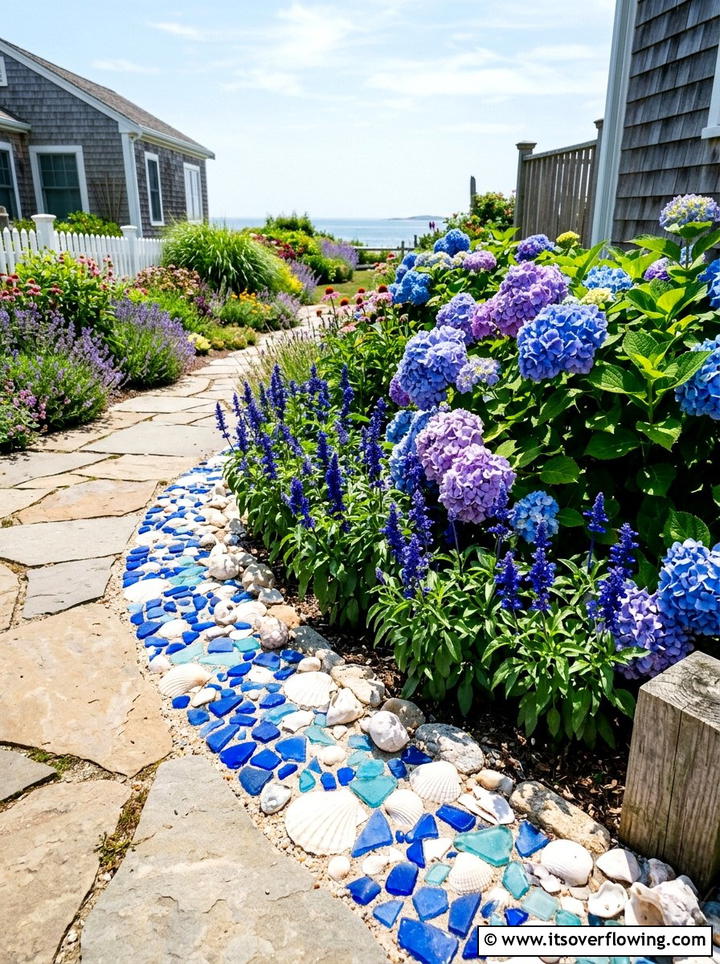 Beach theme garden with blue glass and shells - 25 garden ideas with shell borders