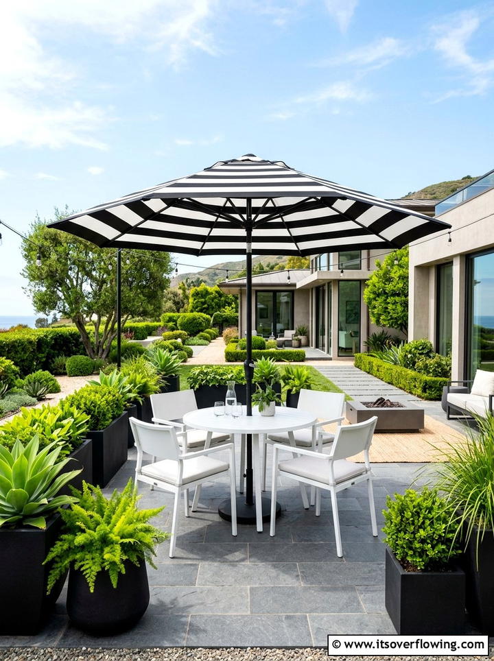 Black And White Striped Umbrella - 25 garden decor ideas with umbrellas
