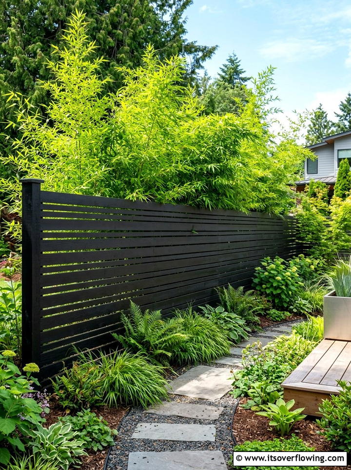 Black Slat Fencing - 25 garden decor ideas for modern gardens