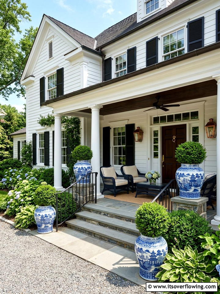 Blue and white ceramic topiary pots - 25 front porch decor ideas with topiaries