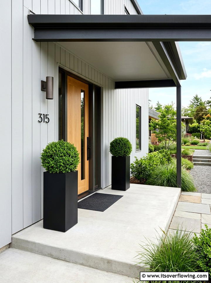 Boxwood In Black Planters - 25 front porch ideas with low maintenance plants