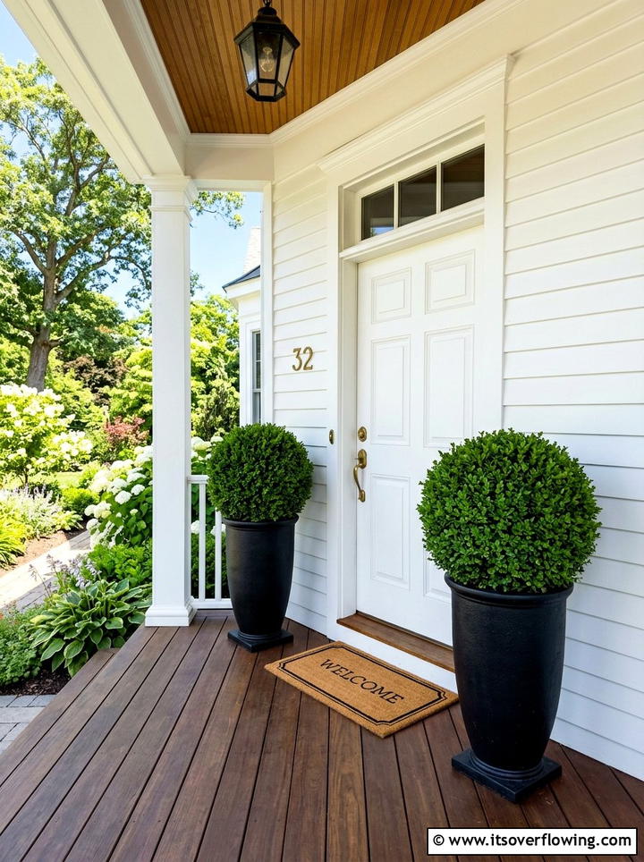 Boxwood topiary - 25 front porch decor ideas with year round greenery