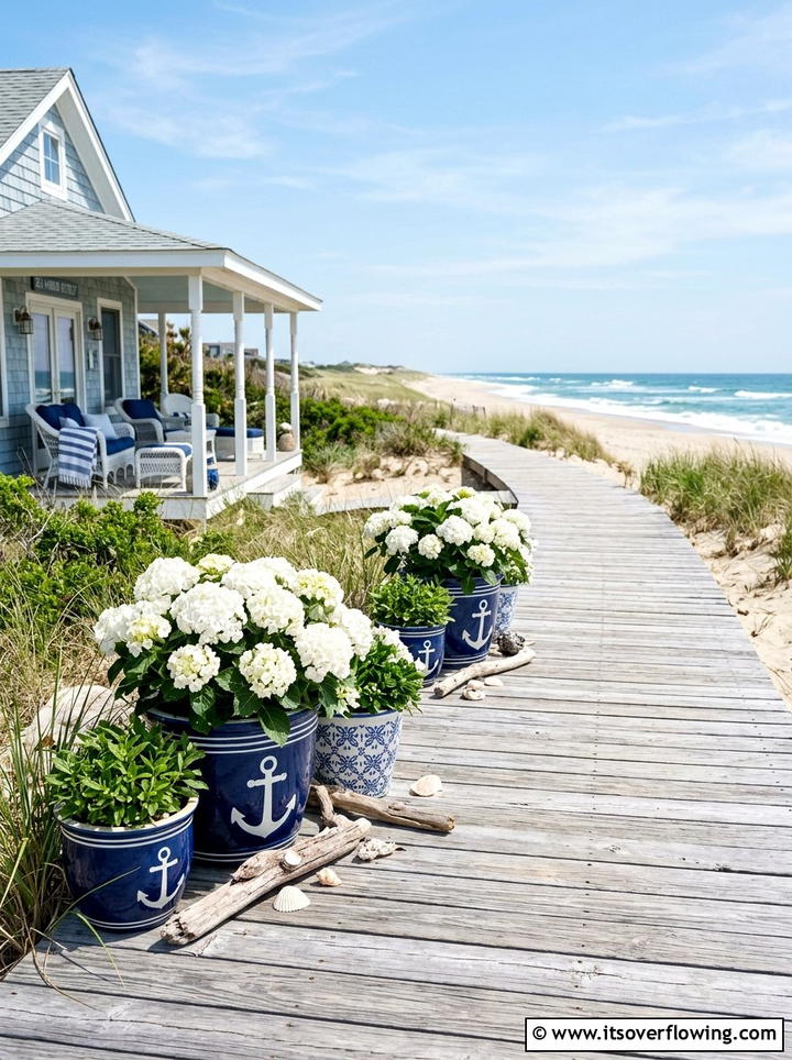 Coastal retreat with blue white planters - 25 creative garden ideas with painted planters