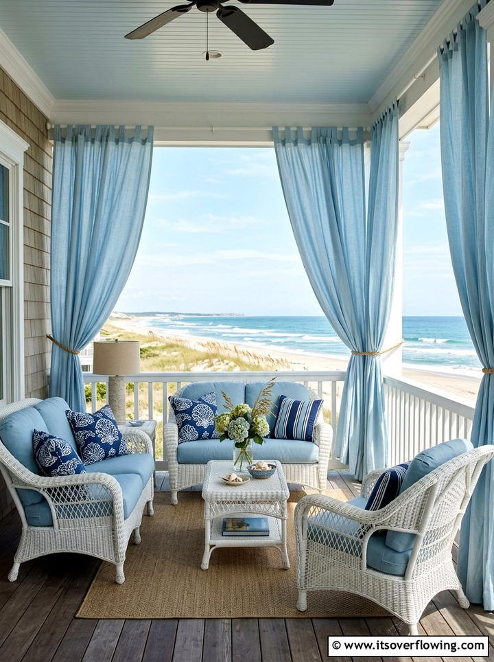 Coastal veranda with light blue curtains - 25 backyard decorating ideas with outdoor curtains