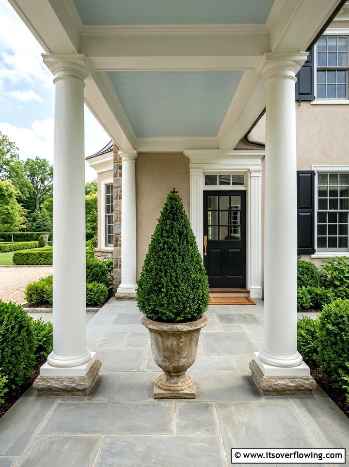 Cone shaped boxwood topiary - 25 front porch ideas with topiaries