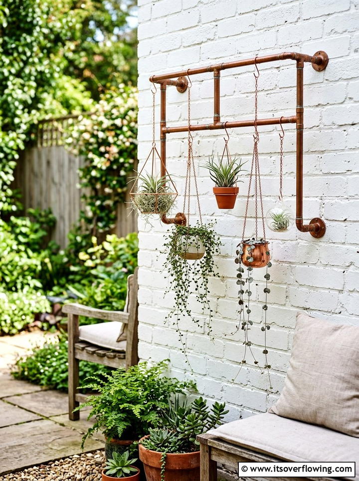 Copper Pipe Plant Hanger - 25 small garden ideas with vertical planters