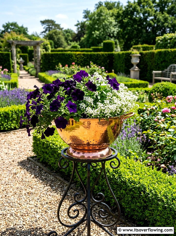 Copper colander planter - 25 upcycled garden ideas with old colanders