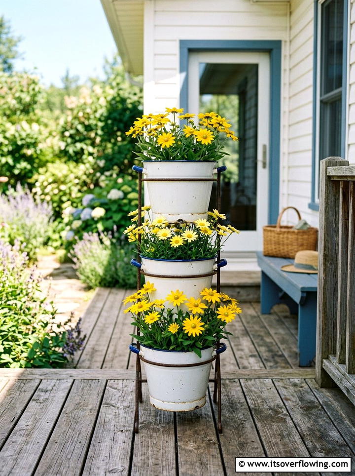Enamelware Bucket Planter - 25 garden decor ideas with farmhouse accents