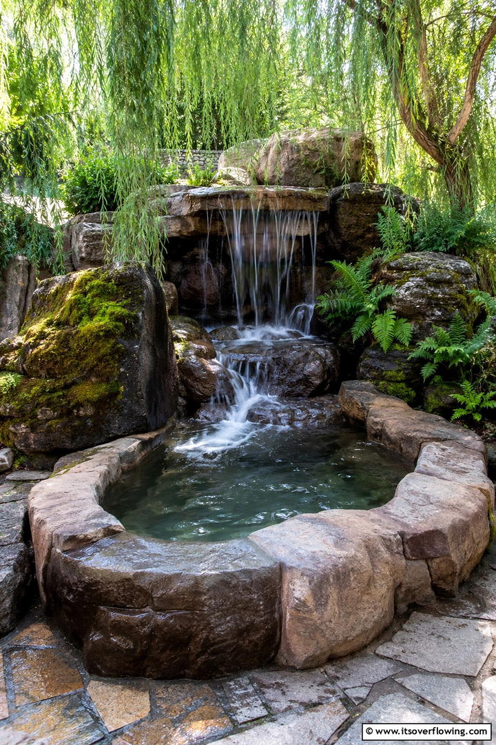 Enchanting Waterfall Soaker - 30 Serene Outdoor Bathtub Ideas for a Backyard Oasis