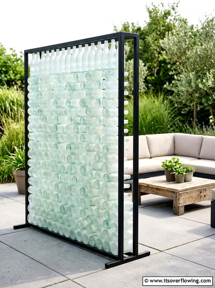 Frosted glass bottle divider - 25 recycled garden ideas with vertical bottle wall