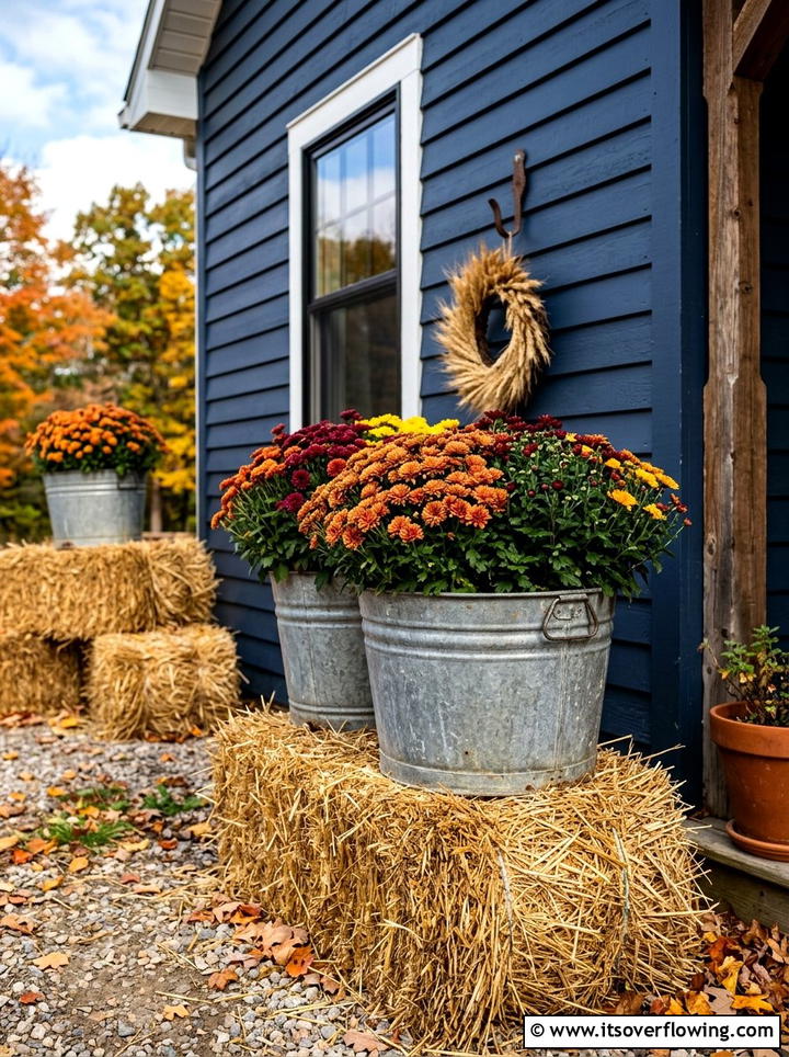 Galvanized Bucket And Hay Bale - 25 front porch decor ideas with mums and hay bales