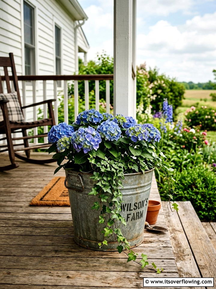 Galvanized bucket planter - 25 upcycled garden ideas with old buckets
