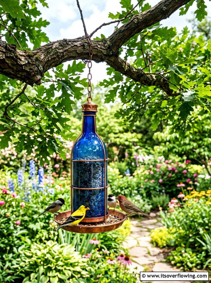 Glass bottle bird feeder - 25 upcycled garden ideas with glass bottles