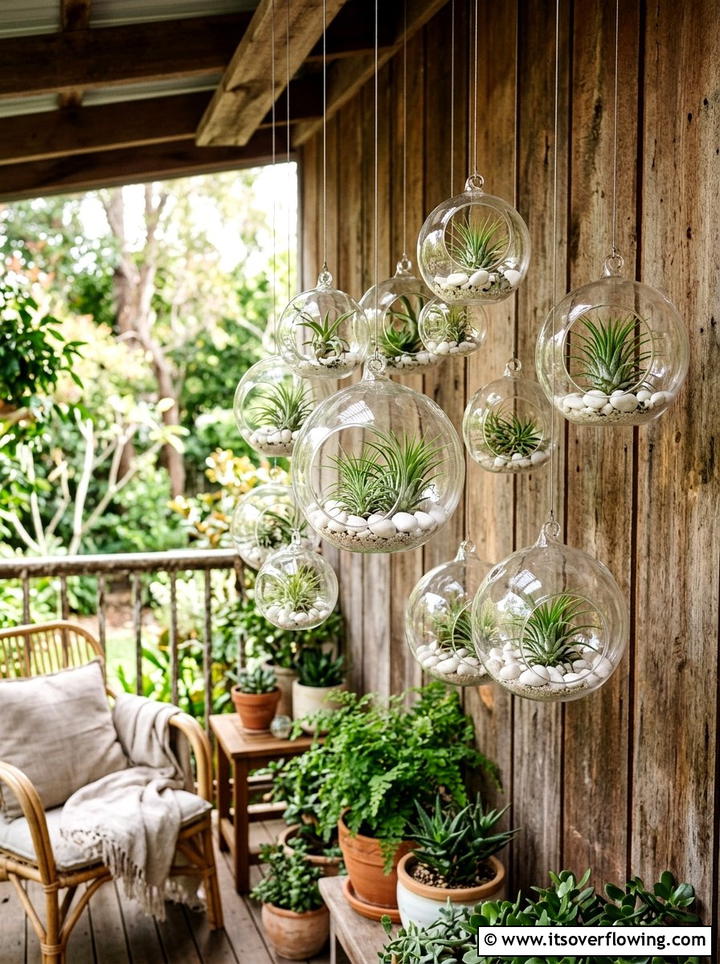 Hanging Glass Terrarium - 25 creative garden ideas with wall mounted planters