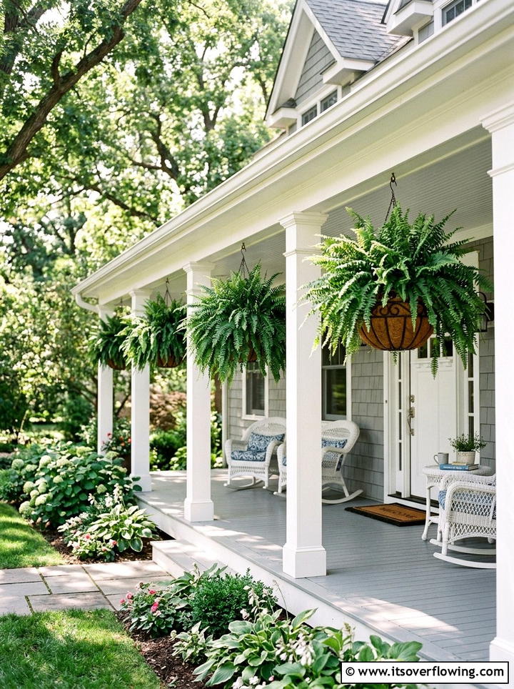 Hanging fern baskets - 25 front porch decor ideas with year round greenery