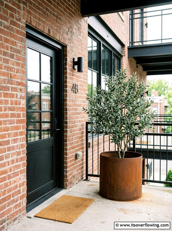 Industrial style porch with faux tree - 25 front porch decor ideas with mini trees