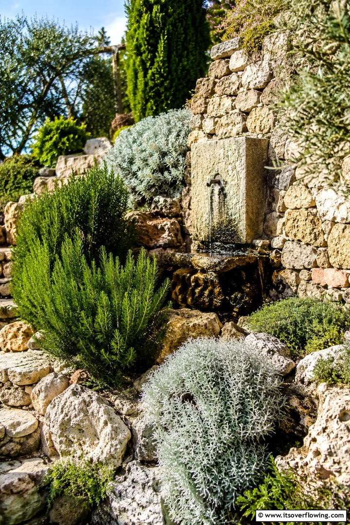 Mediterranean Inspired Rock Garden - 30 Sloped Garden Ideas to Transform Challenging Yards